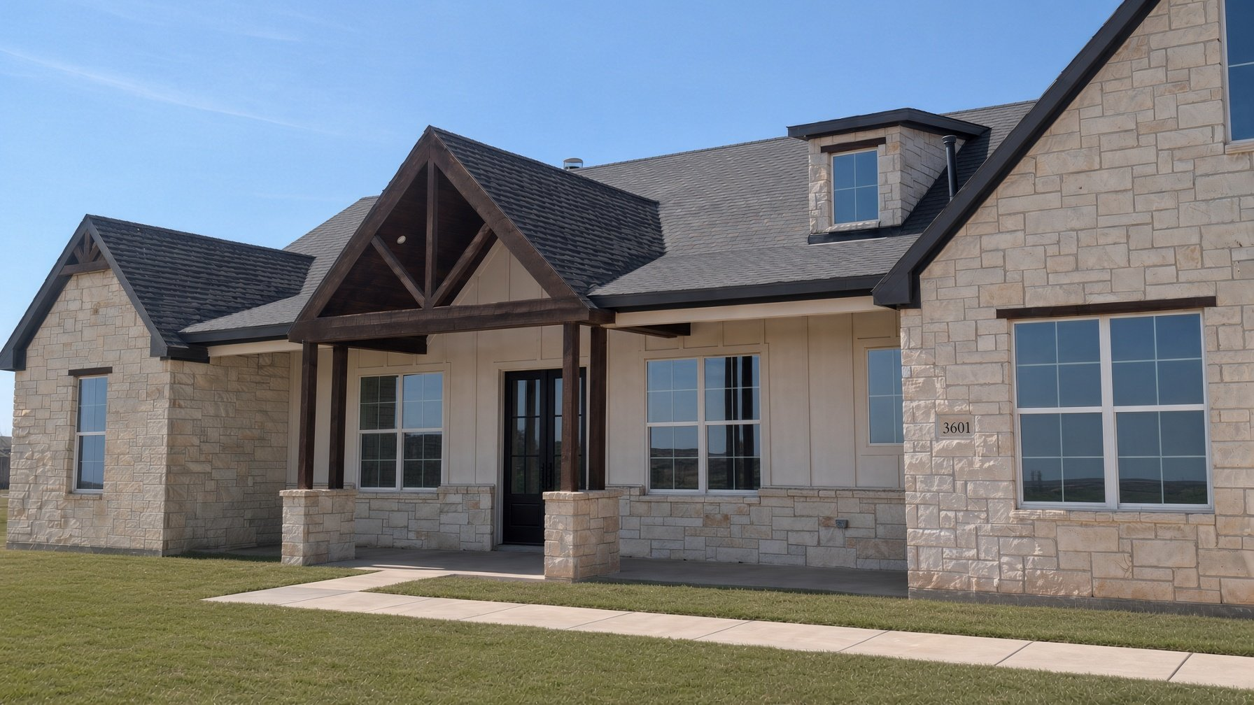 Stone and board-and-batten custom home with a timber-framed front porch, built by Cincero Homes
